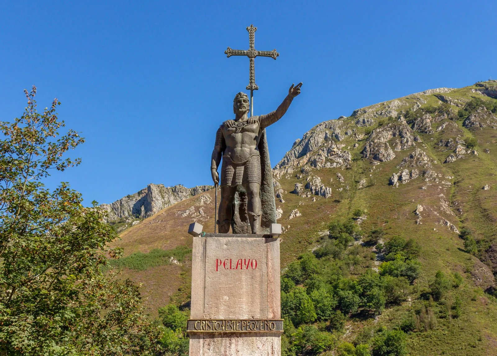 Statue of Pelayo at Covadonga holding a cross aloft